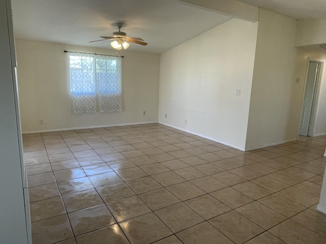 2010 W Lumber St, Lancaster, CA 93536 - tiled empty room with ceiling fan and baseboards