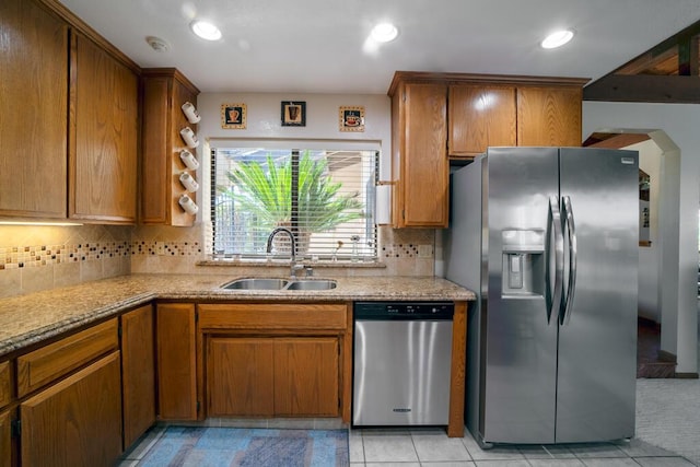 21561 Sheridan Ct, California City, CA 93505 - kitchen featuring brown cabinets, a sink, stainless steel appliances, recessed lighting, and tasteful backsplash