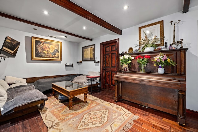 living room with beamed ceiling and hardwood / wood-style flooring