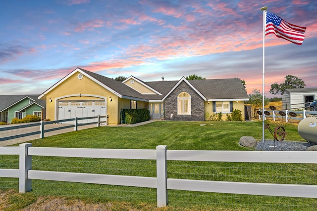 ranch-style house with a lawn and a garage