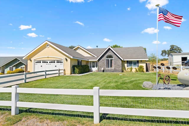 view of front facade with a garage and a front lawn