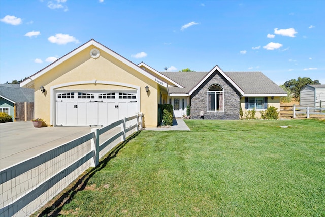 single story home with a front lawn and a garage