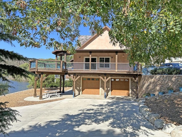 view of front of property with a garage and a deck