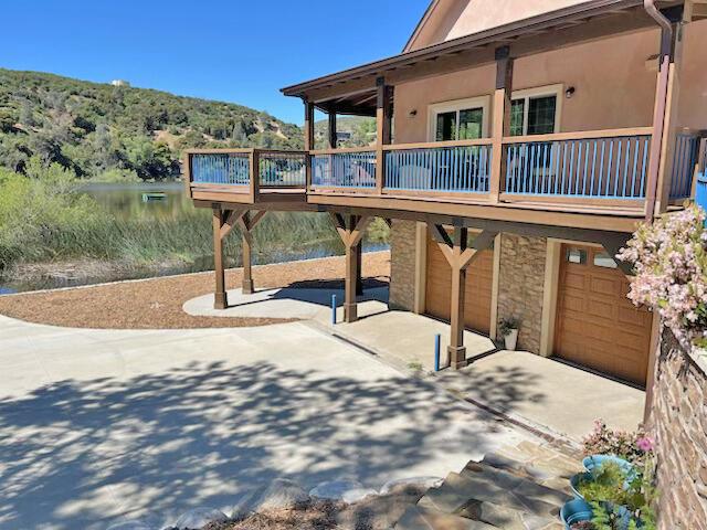 exterior space featuring a wooden deck and a garage