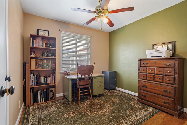 206 Brentwood Dr, Tehachapi, CA 93561 - office area with dark wood-style flooring, a ceiling fan, and baseboards