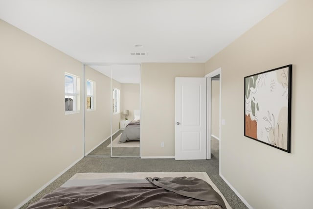 bedroom with a closet and carpet flooring