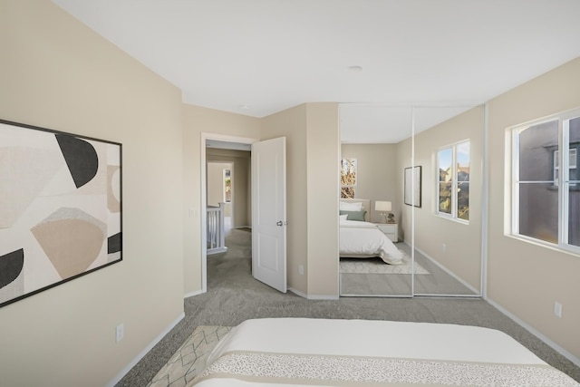 carpeted bedroom featuring a closet