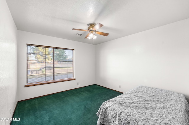 2613 W W Ave K4, Lancaster, CA 93536 - bedroom with dark colored carpet and ceiling fan