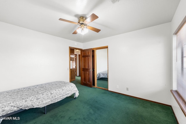 2613 W W Ave K4, Lancaster, CA 93536 - bedroom featuring dark carpet, ceiling fan, and a closet