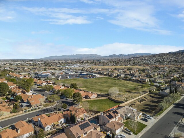 birds eye view of property featuring a mountain view and a residential view