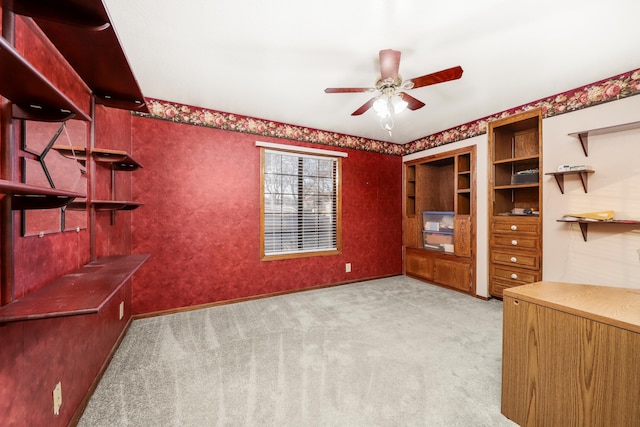 unfurnished office featuring light colored carpet and ceiling fan