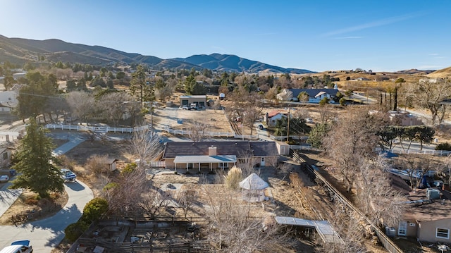 birds eye view of property featuring a mountain view