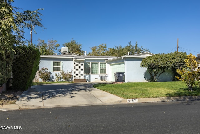 817 W J6, Lancaster, CA 93534 - ranch-style house featuring stucco siding, a front yard, and driveway