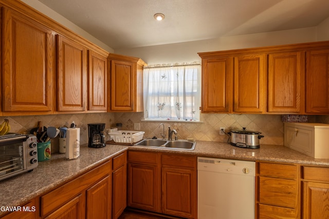 817 W J6, Lancaster, CA 93534 - kitchen featuring white dishwasher, tasteful backsplash, and brown cabinetry