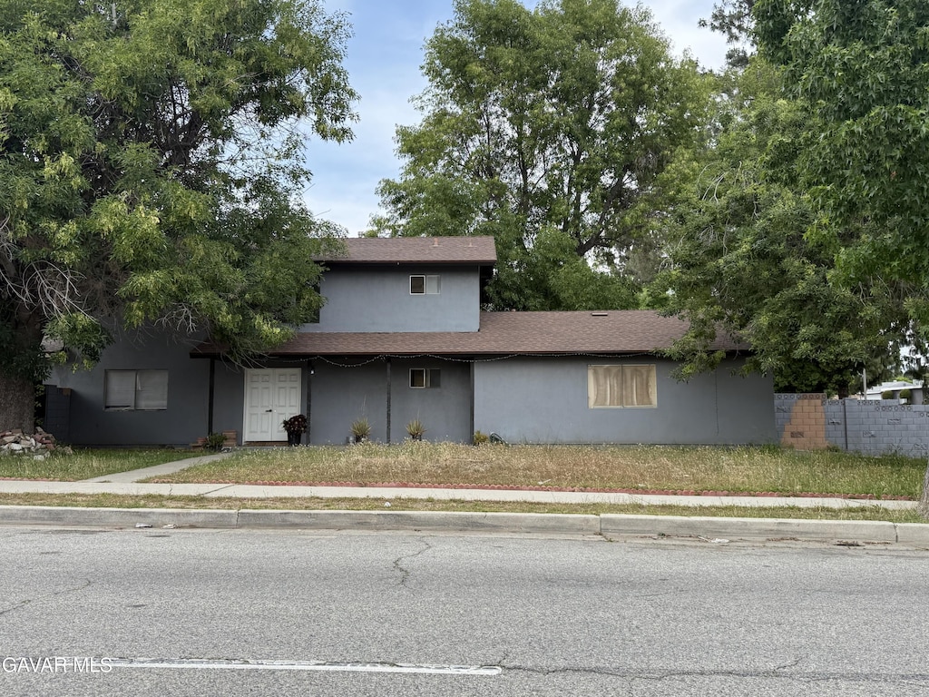 15245 Monte St, Sylmar, CA 91342 - traditional home with stucco siding and roof with shingles