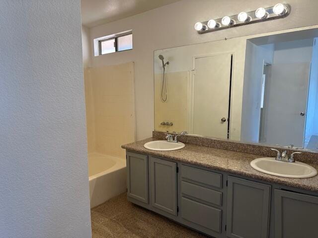 bathroom featuring vanity and shower / bath combination