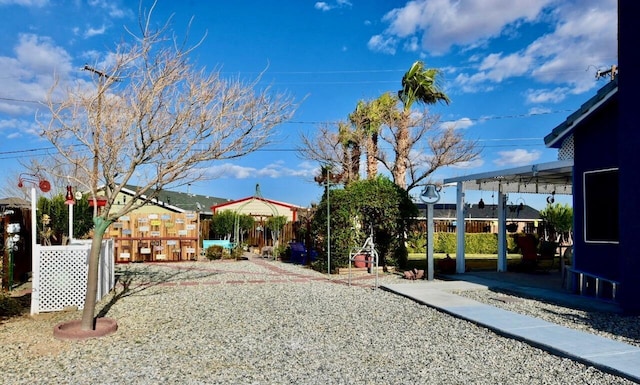 view of yard featuring a patio area and fence