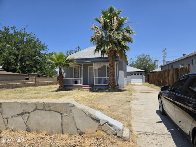 941 W Oldfield St, Lancaster, CA 93534 - view of front facade with a porch and a garage