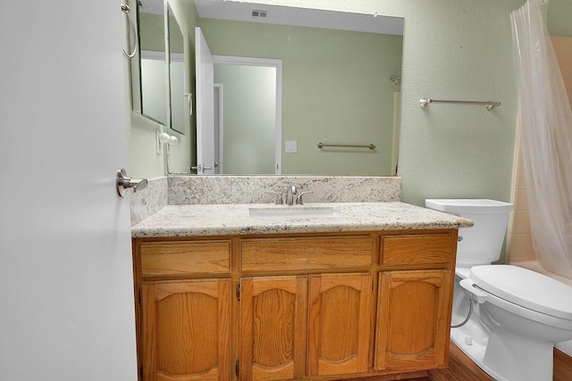 full bathroom featuring vanity, toilet, and shower / tub combo with curtain