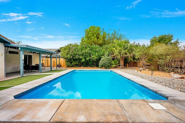 view of swimming pool featuring a patio