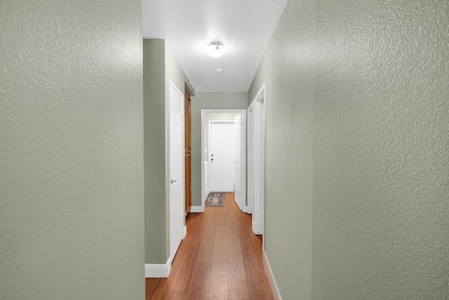 corridor featuring light hardwood / wood-style floors