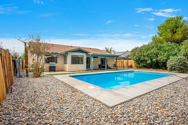 view of pool with a patio and area for grilling