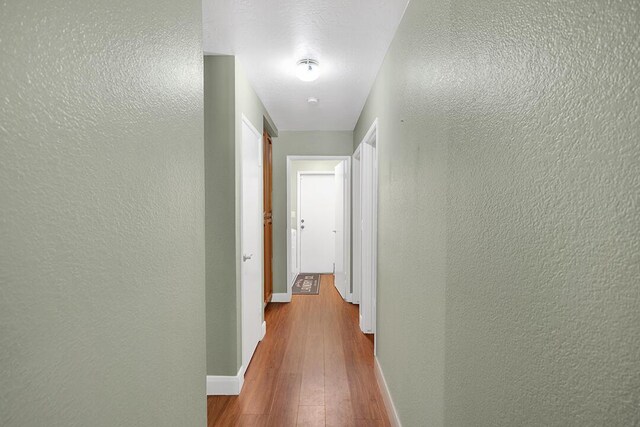 bedroom with access to exterior, light wood-type flooring, ceiling fan, and ornamental molding