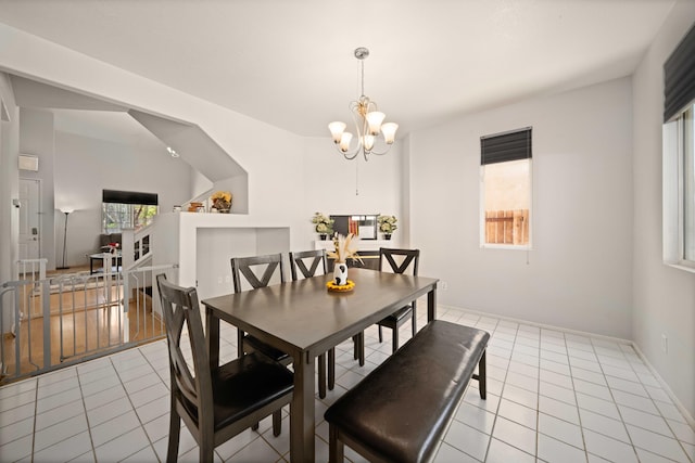 36933 Cadmia Ct, Palmdale, CA 93552 - dining area with light tile patterned floors and a chandelier
