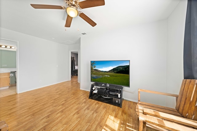36933 Cadmia Ct, Palmdale, CA 93552 - living area with light wood finished floors, ceiling fan, and baseboards