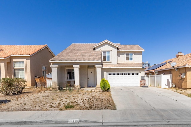 36933 Cadmia Ct, Palmdale, CA 93552 - view of front of property featuring a tile roof, stucco siding, driveway, a garage, and covered porch
