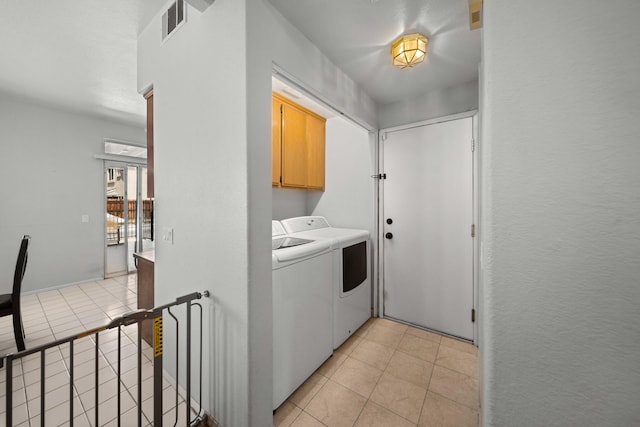 36933 Cadmia Ct, Palmdale, CA 93552 - washroom featuring cabinet space, independent washer and dryer, and light tile patterned flooring
