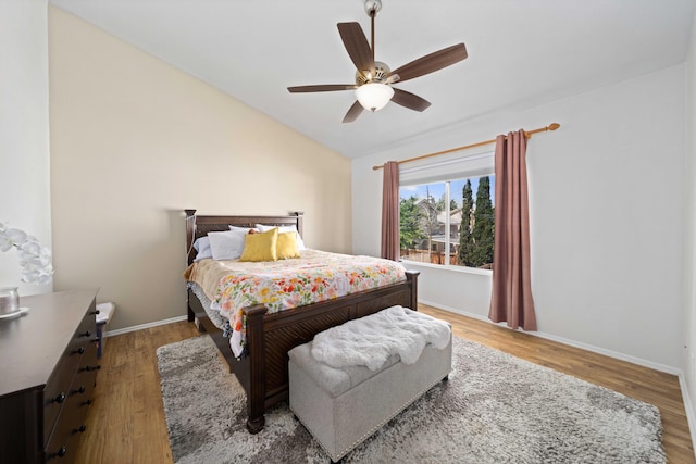 36933 Cadmia Ct, Palmdale, CA 93552 - bedroom with wood finished floors, baseboards, vaulted ceiling, and a ceiling fan