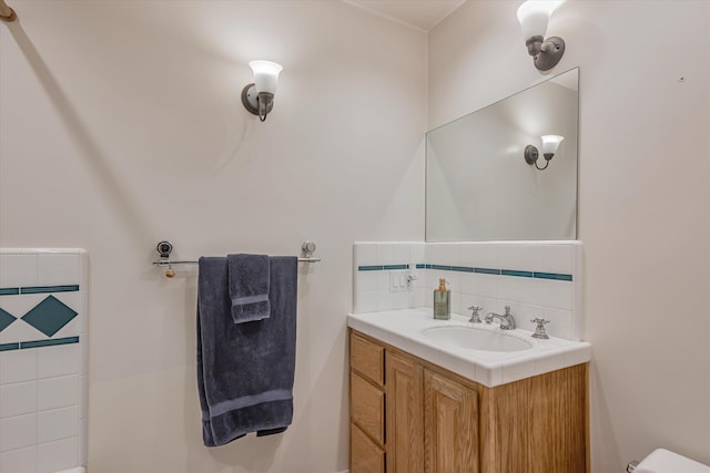 bathroom with backsplash and vanity