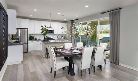 dining area with light hardwood / wood-style floors