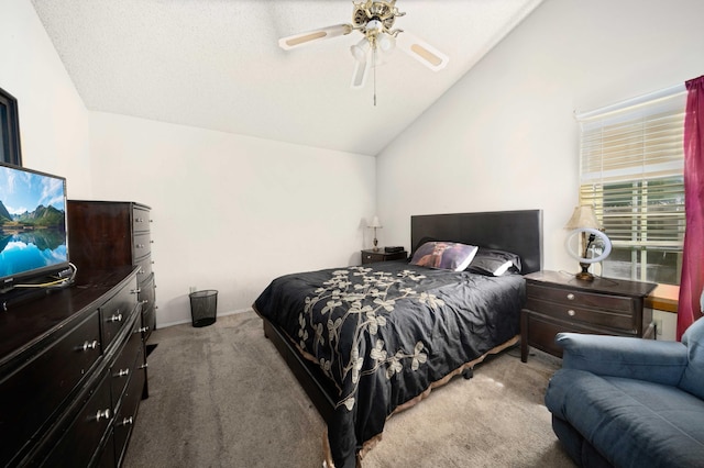 carpeted bedroom with ceiling fan and lofted ceiling