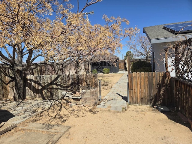 view of yard with a gate and fence private yard