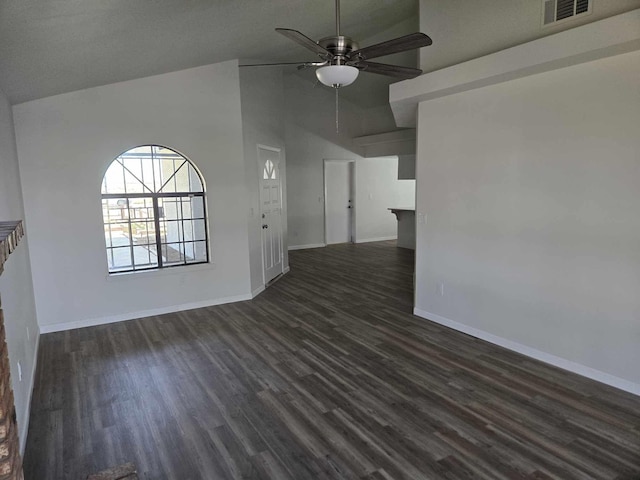 empty room with a ceiling fan, dark wood-type flooring, baseboards, and visible vents