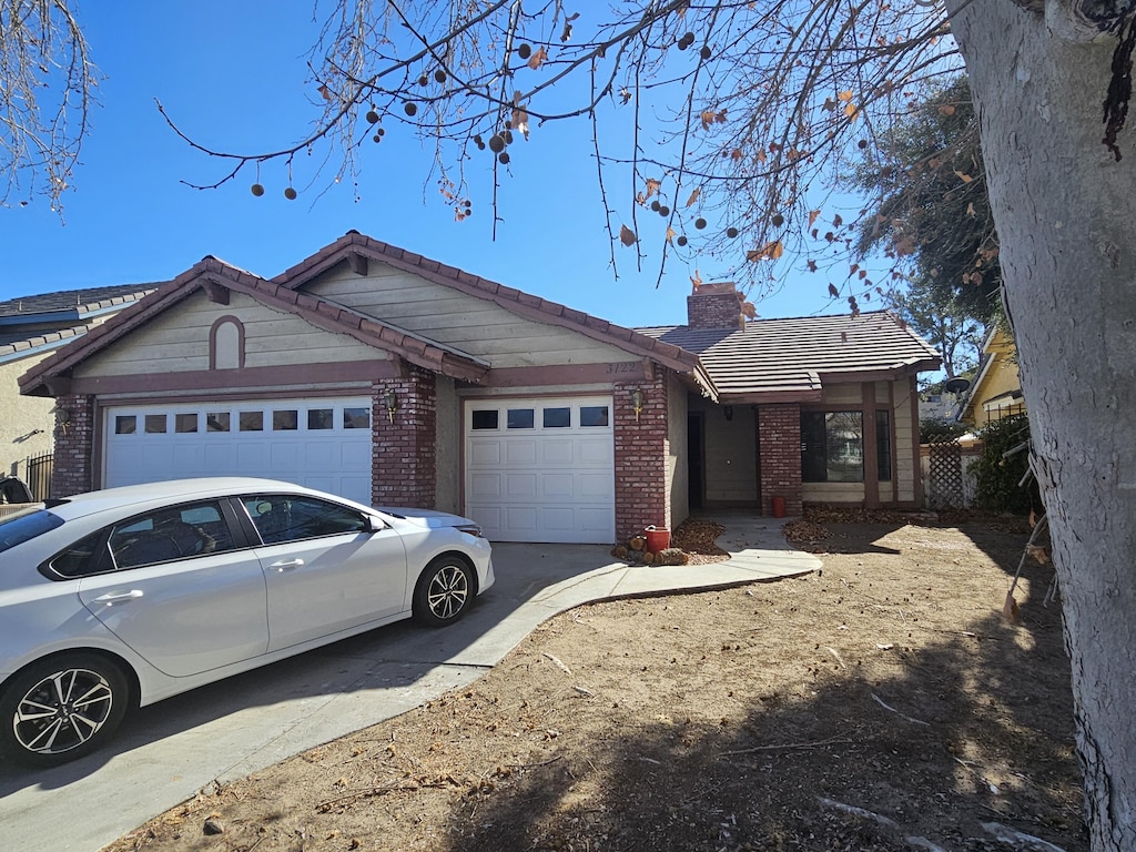 single story home featuring a garage