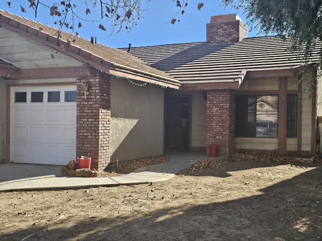 doorway to property with a garage