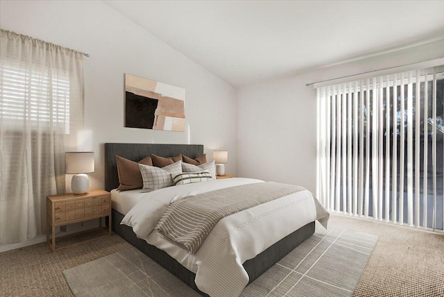 bedroom featuring carpet floors and vaulted ceiling