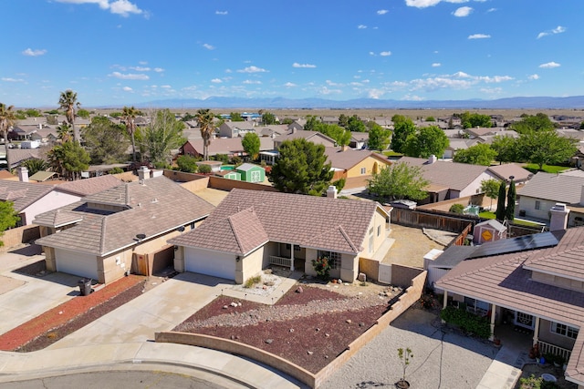 drone / aerial view featuring a residential view and a mountain view