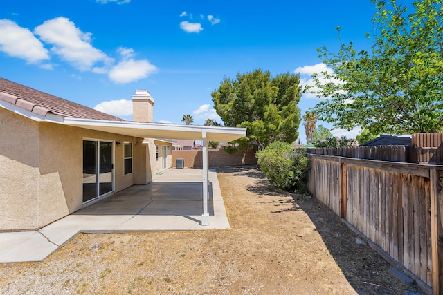 view of yard with a fenced backyard and a patio area