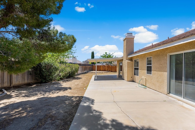 view of yard featuring a fenced backyard and a patio area