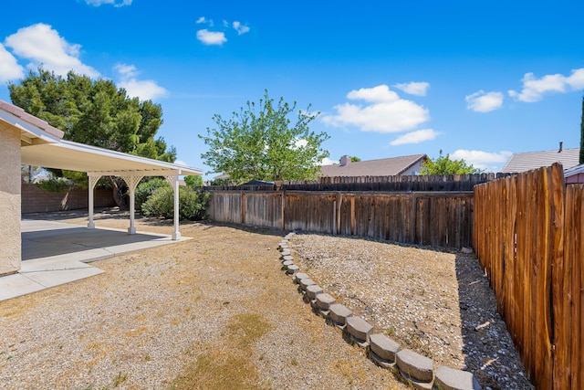 view of yard with a fenced backyard and a patio area