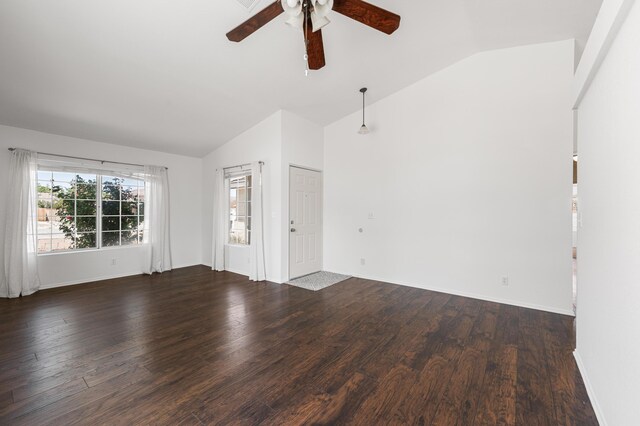 unfurnished living room featuring baseboards, ceiling fan, wood finished floors, and lofted ceiling