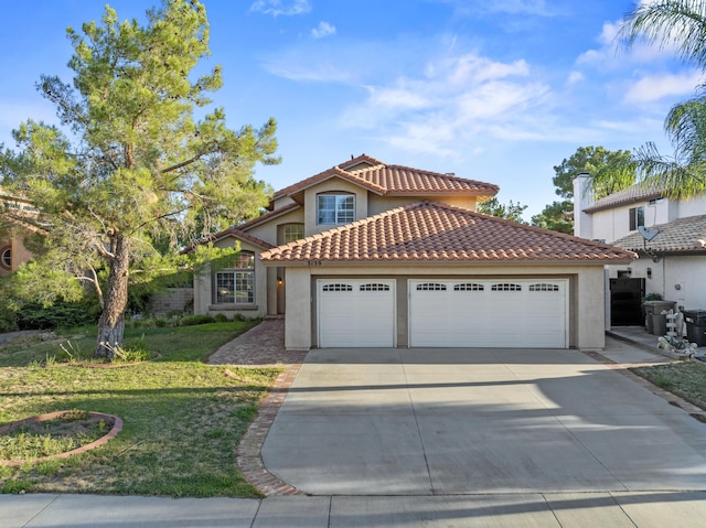 mediterranean / spanish-style house with a garage and a front lawn