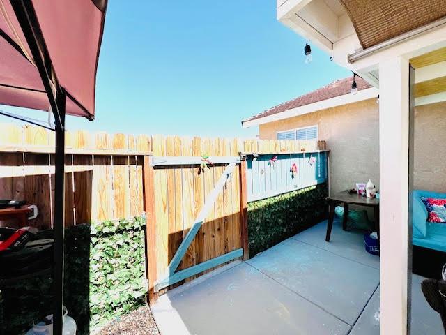 view of gate with fence