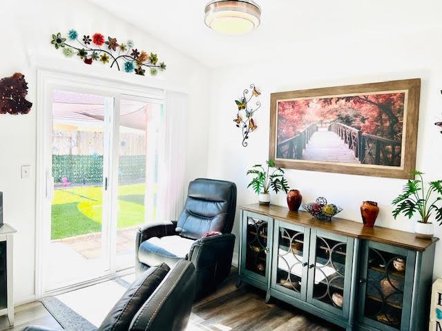 living area with wood finished floors