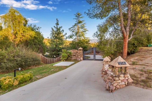view of community featuring a gate and fence