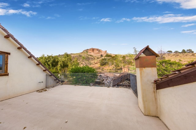 view of patio / terrace featuring a balcony and a mountain view